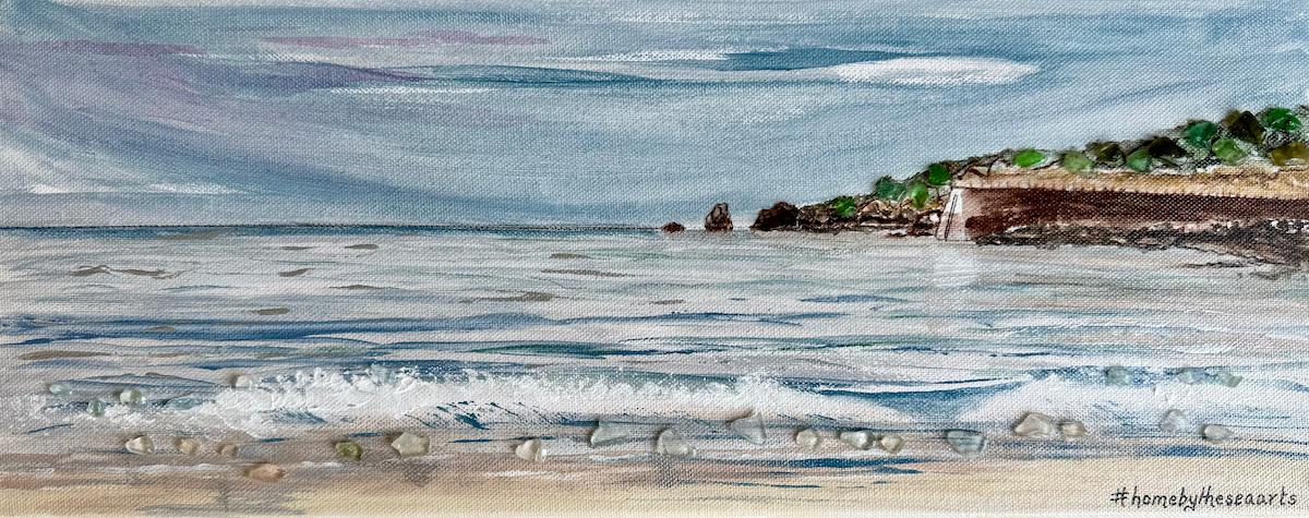 Hand-painted coastal artwork of St Brelade’s Beach and Pier with Jersey sea glass details in the waves and headland, on a 50x20cm canvas.